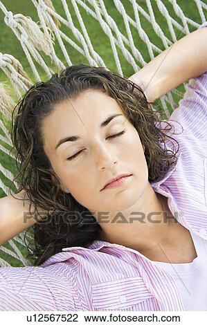 Woman resting in hammock View Large Photo Image Stock Image - Woman resting in hammock. Fotosearch