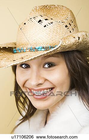 Stock Photograph - Woman wearing cowboy hat. Fotosearch