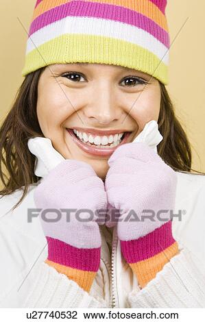 Woman wearing winter hat and gloves View Large Photo Image Stock Image - Woman wearing winter hat and gloves . Fotosearch