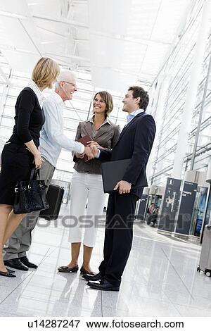 4 people greeting each other View Large Photo Image Stock Photo - 4 people greeting each other. Fotosearch