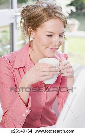 Female reading an email View Large Photo Image Picture - Female reading an email. Fotosearch