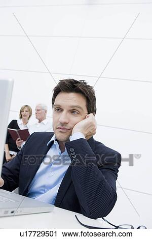 Man bored sitting at table View Large Photo Image Stock Image - Man bored sitting at table. Fotosearch