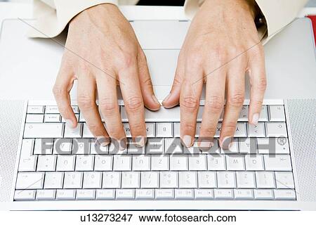 Pair of hands at keyboard View Large Photo Image Stock Photo - Pair of hands at keyboard. Fotosearch