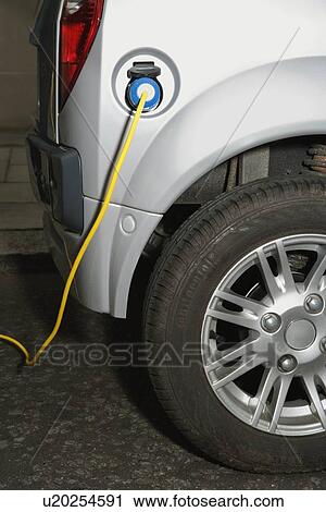 Electric cable attached to electric car View Large Photo Image Stock Image - Electric cable attached to electric car. Fotosearch