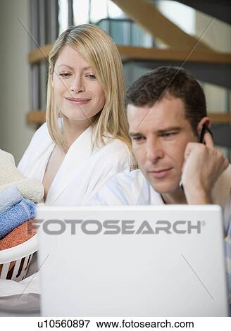 A couple working at home View Large Photo Image Stock Photo - A couple working at home. Fotosearch