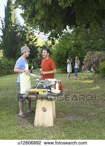 Friends at barbecue View Large Photo Image Stock Image - Friends at barbecue. Fotosearch