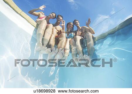 Friends waving from edge of pool View Large Photo Image Stock Photo - Friends waving from edge of pool. Fotosearch