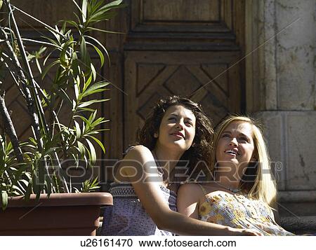 Girls looking in sunshine View Large Photo Image Stock Image - Girls looking in sunshine. Fotosearch