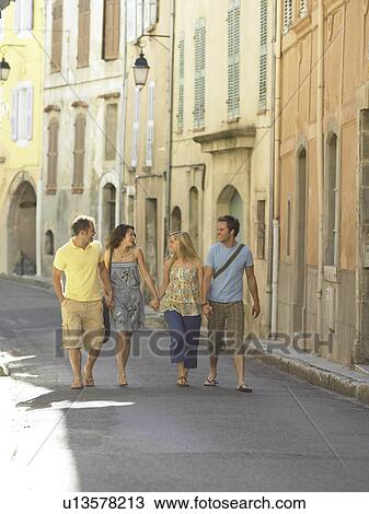 Group walking along street View Large Photo Image Stock Image - Group walking along street. Fotosearch
