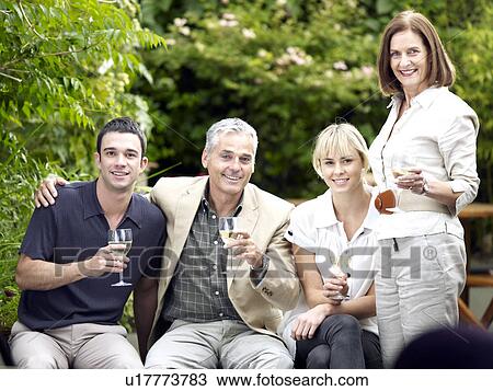 Family occasion in garden View Large Photo Image Stock Image - Family occasion in garden. Fotosearch