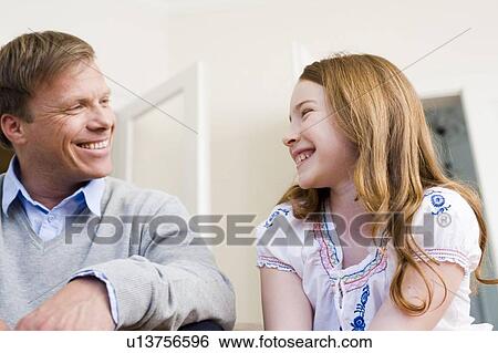 Father and daughter smiling View Large Photo Image Stock Photograph - Father and daughter smiling. Fotosearch