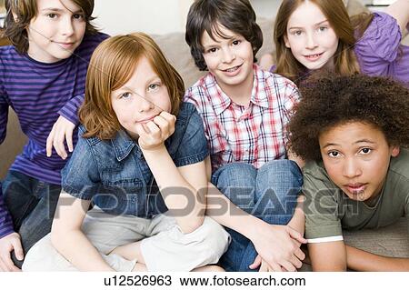Four boys, one girl looking up to camera View Large Photo Image Stock Image - Four boys, one girl looking up to camera. Fotosearch