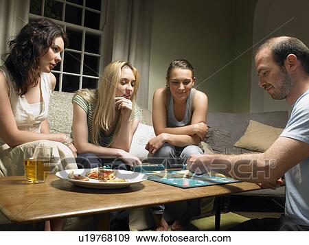 Four young people playing scrabble View Large Photo Image Stock Photo - Four young people playing scrabble. Fotosearch