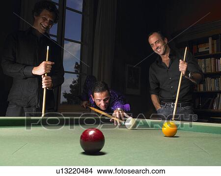 Picture - Men playing snooker. Fotosearch