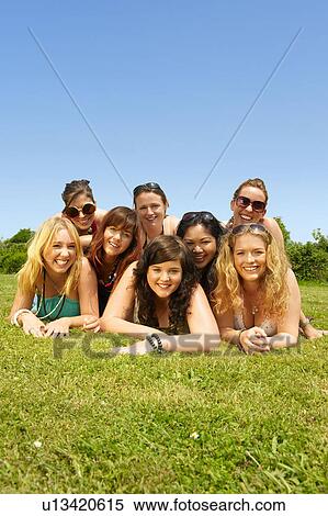Portrait of eight women lying down View Large Photo Image Stock Photography - Portrait of eight women lying down. Fotosearch