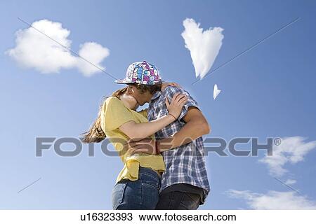 Teen couple kissing View Large Photo Image Stock Image - Teen couple kissing. Fotosearch