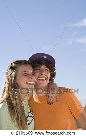 Teen couple portrait smiling View Large Photo Image Stock Photo - Teen couple portrait smiling. Fotosearch