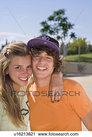 Teen couple smiling View Large Photo Image Stock Image - Teen couple smiling. Fotosearch