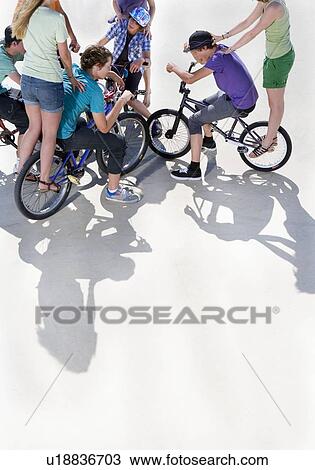 Teen group on bikes View Large Photo Image Stock Image - Teen group on bikes. Fotosearch