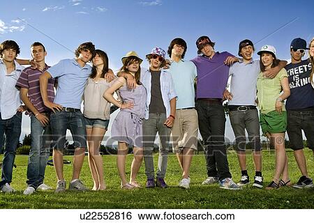 Teen group portrait standing in park View Large Photo Image Stock Photograph - Teen group portrait standing in park. Fotosearch
