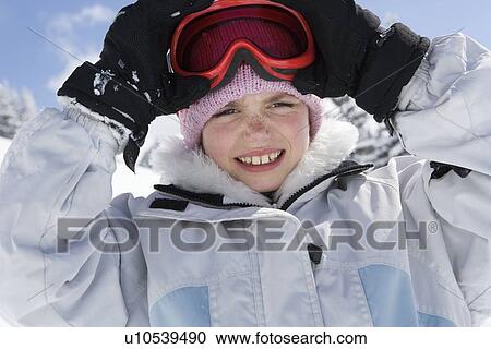 Portrait of girl with hat and goggles View Large Photo Image Stock Image - Portrait of girl with hat and goggles. Fotosearch