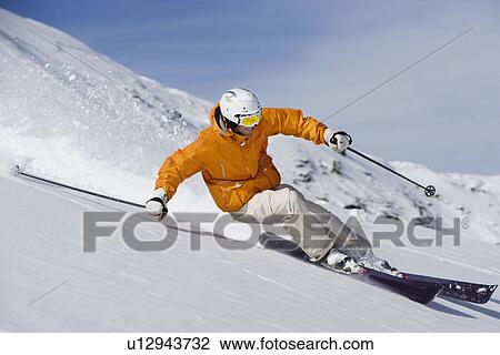 Skier carving through powder snow View Large Photo Image Stock Image - Skier carving through powder snow. Fotosearch