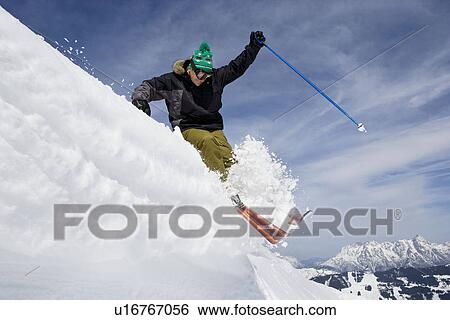 Skier jumping of a cornice View Large Photo Image Stock Photograph - Skier jumping of a cornice. Fotosearch