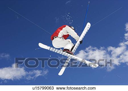 Skier performing jumping trick View Large Photo Image Stock Image - Skier performing jumping trick. Fotosearch