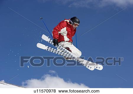 Stock Photo - Skier performing jumping trick. Fotosearch