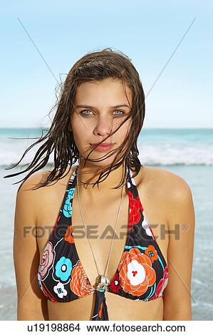 Young girl standing in front of sea View Large Photo Image Picture - Young girl standing in front of sea. Fotosearch