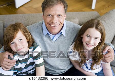 Father in the middle of son and daughter View Large Photo Image Stock Photograph - Father in the middle of son and daughter. Fotosearch
