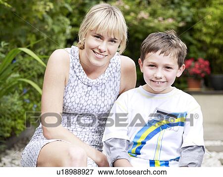 Girl and boy sitting outside on patio View Large Photo Image Stock Photo - Girl and boy sitting outside on patio. Fotosearch