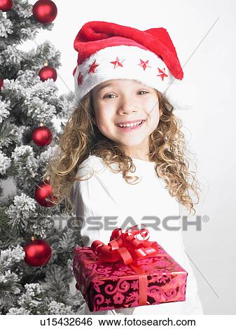 Girl handing a present View Large Photo Image Stock Photograph - Girl handing a present. Fotosearch