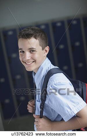School boy holding backpack View Large Photo Image Stock Image - School boy holding backpack. Fotosearch