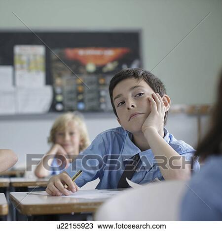 School boy listening in class View Large Photo Image Stock Image - School boy listening in class. Fotosearch