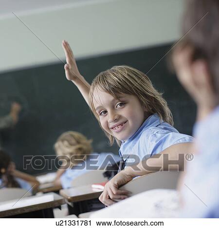 School boy raising hand in class View Large Photo Image Stock Image - School boy raising hand in class. Fotosearch