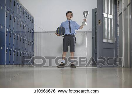 School boy with basketball and trophy View Large Photo Image Stock Photograph - School boy with basketball and trophy. Fotosearch
