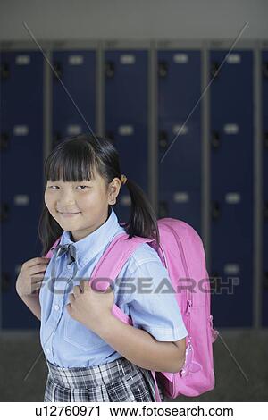 School girl holding backpack View Large Photo Image Stock Image - School girl holding backpack. Fotosearch