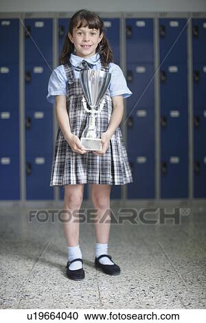 School girl holding trophy View Large Photo Image Stock Image - School girl holding trophy. Fotosearch