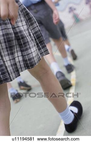 Stock Image - School girl in uniform. Fotosearch