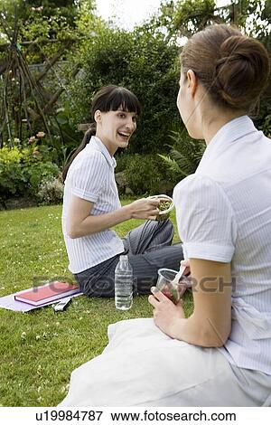 2 businesswomen chatting in park View Large Photo Image Stock Photo - 2 businesswomen chatting in park. Fotosearch