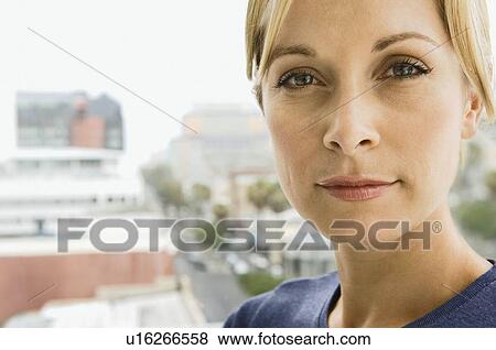 A portrait of a woman looking to camera View Large Photo Image Stock Photo - A portrait of a woman looking to camera. Fotosearch