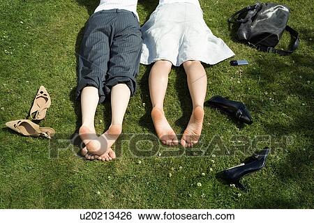 Bare feet of businesswomen on grass View Large Photo Image Stock Photograph - Bare feet of businesswomen on grass. Fotosearch
