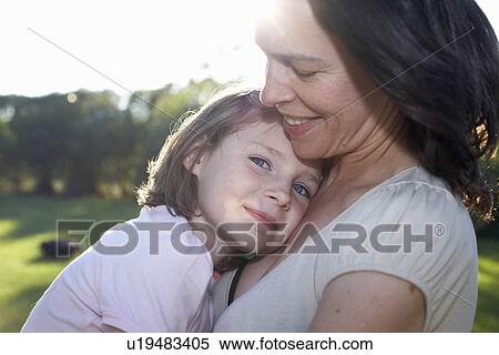 Mother and daughter embracing View Large Photo Image Stock Photography - Mother and daughter embracing. Fotosearch