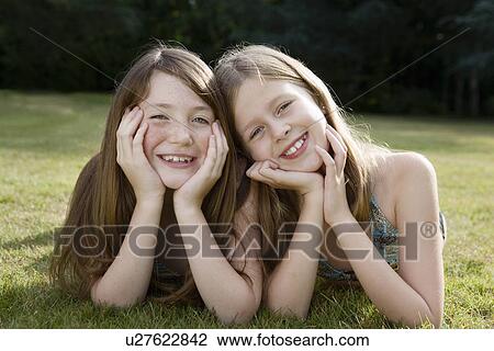 Stock Image - Portrait of two girls. Fotosearch
