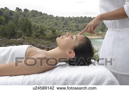 Woman having a massage View Large Photo Image Stock Image - Woman having a massage . Fotosearch