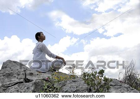 Stock Image - Woman meditating . Fotosearch