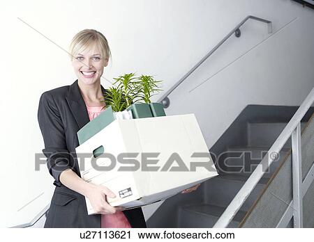Woman on stairs with moving box View Large Photo Image Stock Image - Woman on stairs with moving box. Fotosearch