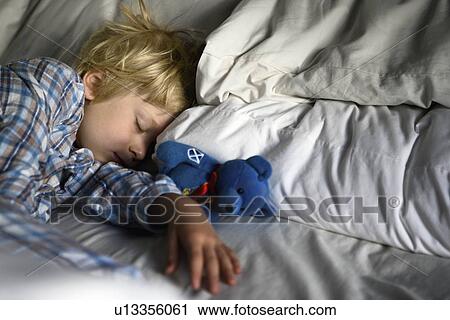 Boy asleep with teddy bear View Large Photo Image Stock Image - Boy asleep with teddy bear. Fotosearch