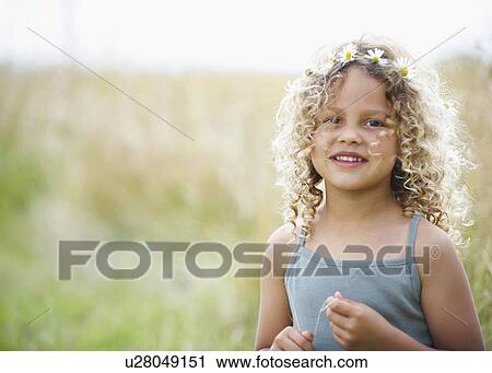 Young girl with daisies in hair View Large Photo Image Stock Image - Young girl with daisies in hair. Fotosearch
